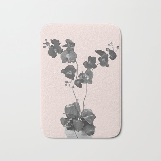 Orchid bloom in pot Bath Mat