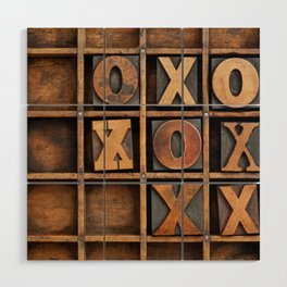 tic-tac-toe or noughts and crosses game - vintage letterpress ing block X and O in wooden grunge typesetter box with dividers Wood Wall Art