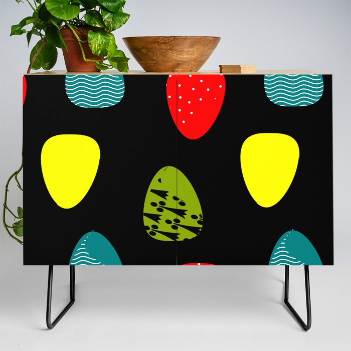 Multicolored eggs on black background Credenza