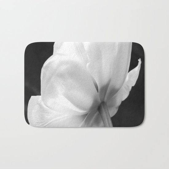 Close-up of white tulip in black background Bath Mat