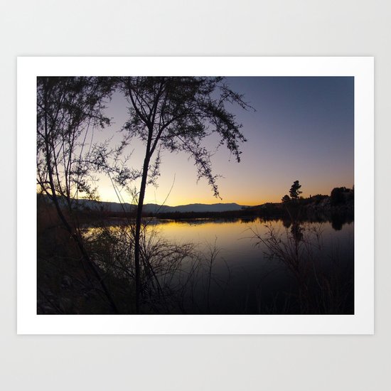 Sunset by the waters edge. Art Print