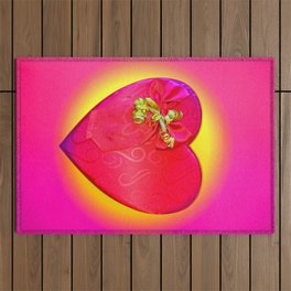 Red valentine heart design shape with a golden tassel on a yellow and pink background Outdoor Rug