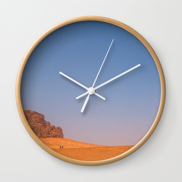 Two lonely hikers in magnificent Wadi Rum desert, Jordan Wall Clock