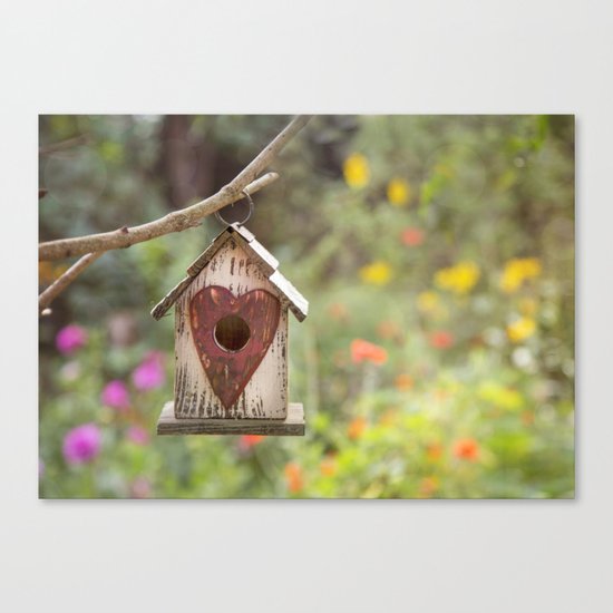 bird house in summer garden Canvas Print