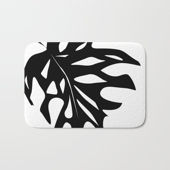 Black leaf monstera on white background . Bath Mat