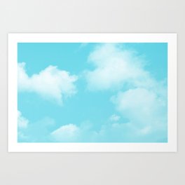 Cute puffy small white clouds on a sunny aqua blue sky Art Print