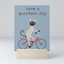 Siamese cat on bicycle Mini Art Print