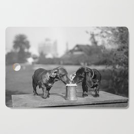 Two dogs and a beer; Dachshund siblings sharing a stein of beer on hot summer day funny humorous animal portrait photograph - photography - photographs Cutting Board