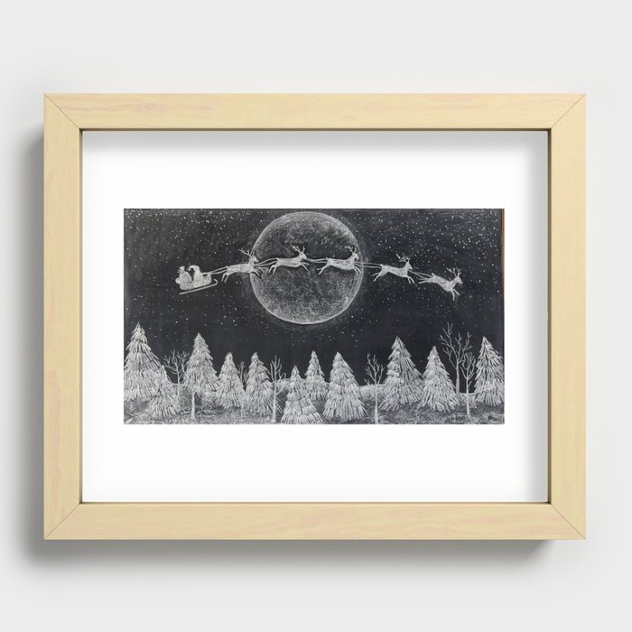 Santa flying over a winter wonderland of snow covered trees in his reindeer drawn sleigh by the light of a full moon Recessed Framed Print