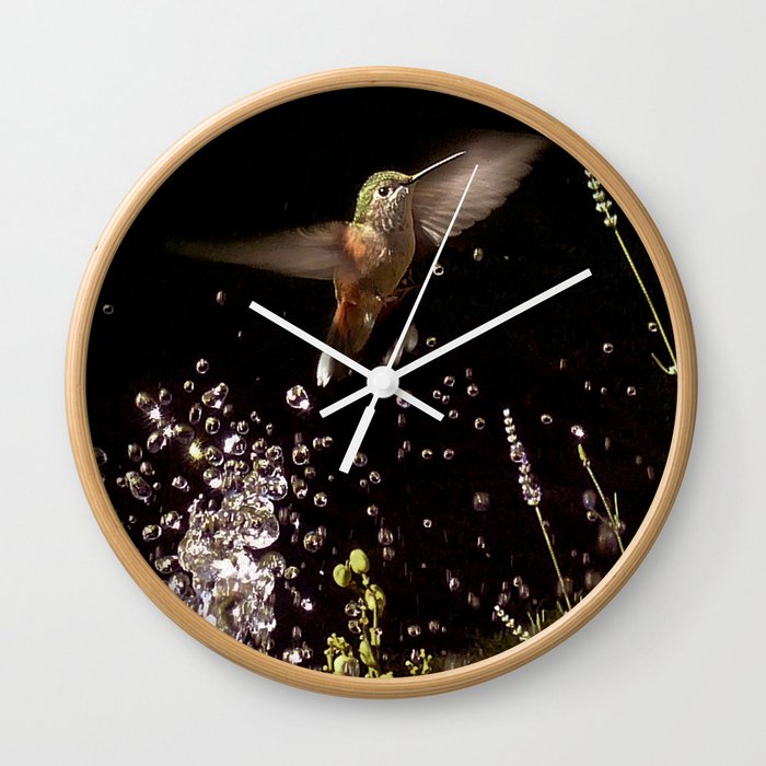 Hummingbird plays in water Wall Clock