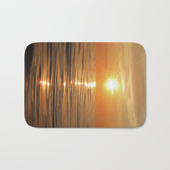 Sun setting over calm waters Bath Mat