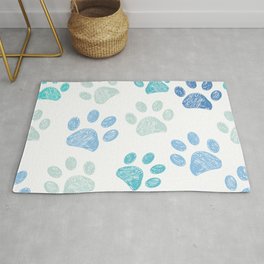 Blue colored paw print background Rug