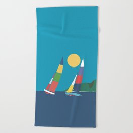 Sails below the coast Beach Towel