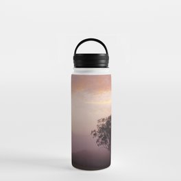 /// Bubble gum mornings /// Landscape photography of early morning tree in the fog at sunrise, NSW Australia Water Bottle