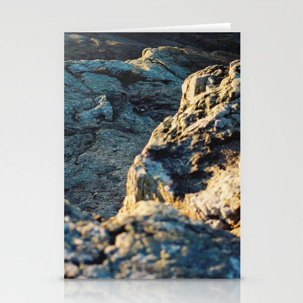 The sun is setting over the rocks Stationery Cards