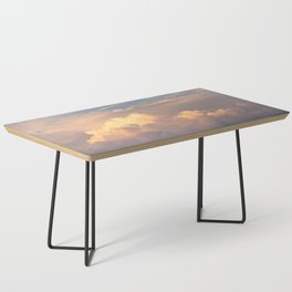 Cloudy orange sunset over the mountains Coffee Table