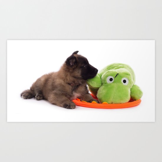 Puppy cuddling green toy Art Print