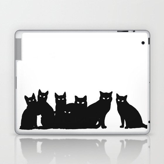 Seven black cats in white space. Laptop & iPad Skin