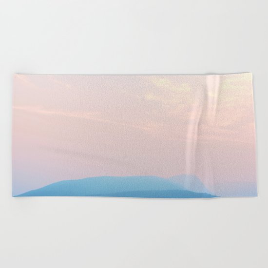 Pastel sunset over the mountains Beach Towel