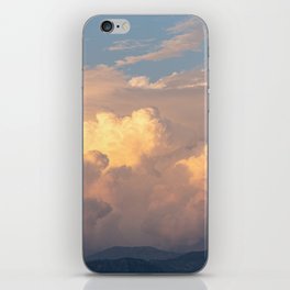 Cloudy orange sunset over the mountains iPhone Skin