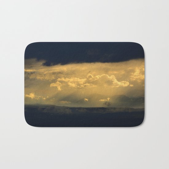 Storm through the mountains at sunset Bath Mat