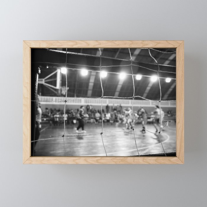 Black and White Photo of a handball game from behind the net Framed Mini Art Print