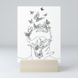 Woman face with butterfly. Line art female hands with butterflies. Abstract face with butterfly by one line drawing. Portrait minimalistic style. Botanical print. Nature symbol of cosmetics.  Mini Art Print