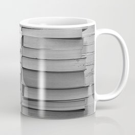 Black and white image of some books stacked on a shelf Coffee Mug