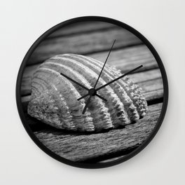 Half a sea shell on wood Wall Clock
