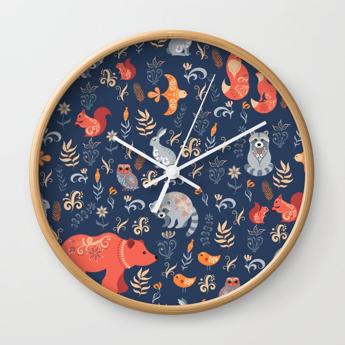 Fairy-tale forest. Fox, bear, raccoon, owls, rabbits, flowers and herbs on a blue background. Seamle Wall Clock