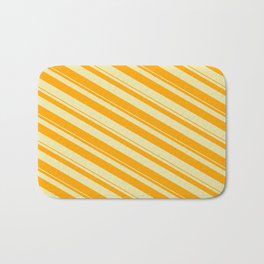 [ Thumbnail: Pale Goldenrod & Orange Colored Pattern of Stripes Bath Mat ]