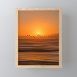 Birds flying across a sunset at the beach Framed Mini Art Print