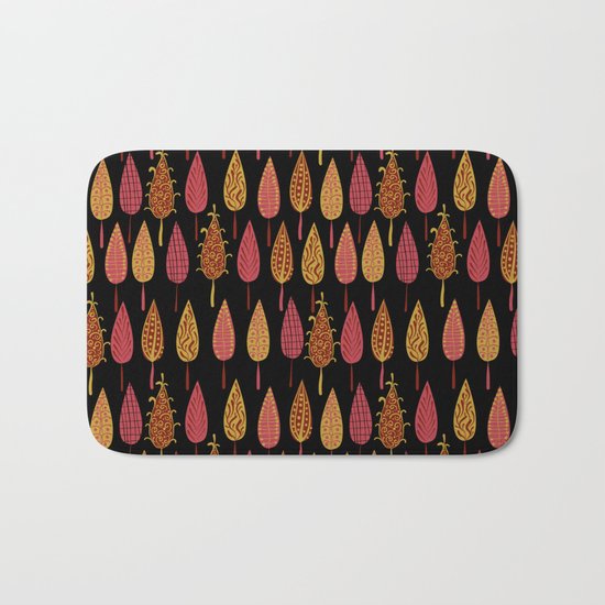 Autumn leaves on a black background . Bath Mat