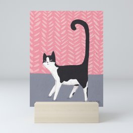 Tuxedo Cat Against Pink Wall Mini Art Print
