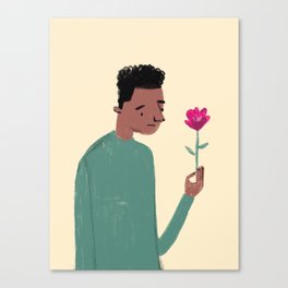 African American Boy in Green Shirt looking at pink flower Canvas Print