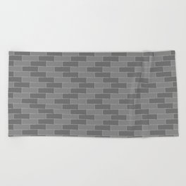 Brick wall in grayscale Beach Towel