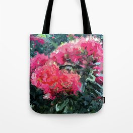Red flower blossoms amid lush green foliage Tote Bag