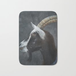 Portrait of a black and white horned goat Bath Mat