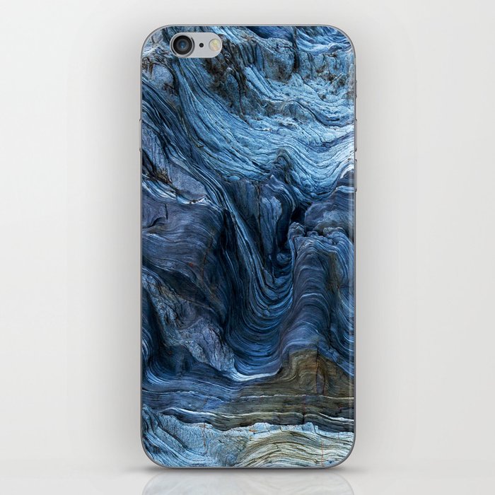 Detail of a rock with variants of blue. Rock full of curves and smooth cuts resulting from the erosive effect of sea. Close up rocks, texture dramatic and colorful erosional water formation. Stone iPhone Skin