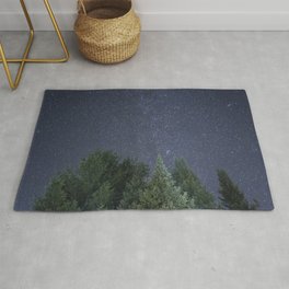 Pine trees with the northern michigan night sky Rug