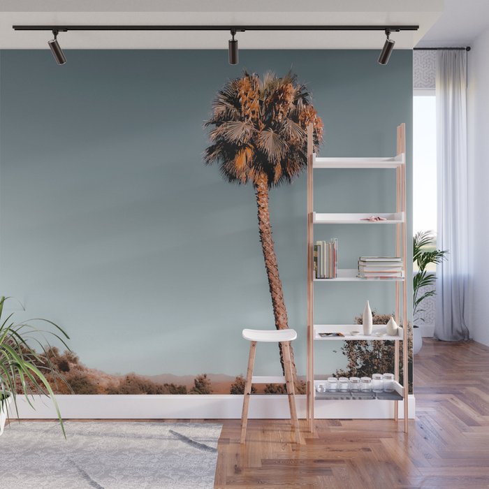 isolated palm tree with mountain and blue sky background Wall Mural