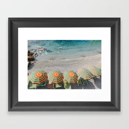 Umbrellas on the beach Framed Art Print