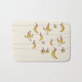 Bananas on clothespins Bath Mat