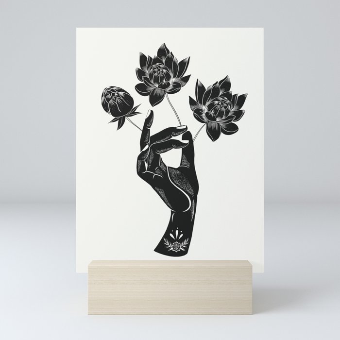 Hand holding lotus flowers  Mini Art Print