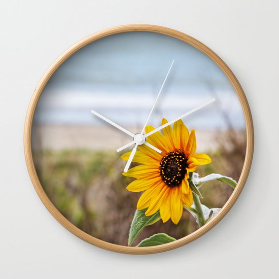 Sunflower near ocean Wall Clock