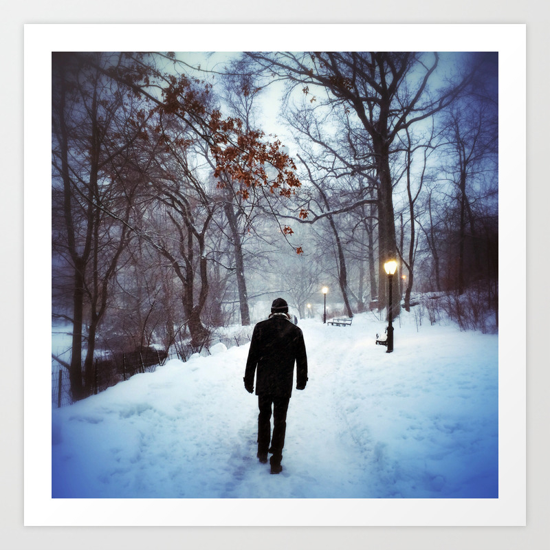 A Man Walks Down A Lit Path Near The Pool In Central Park On A