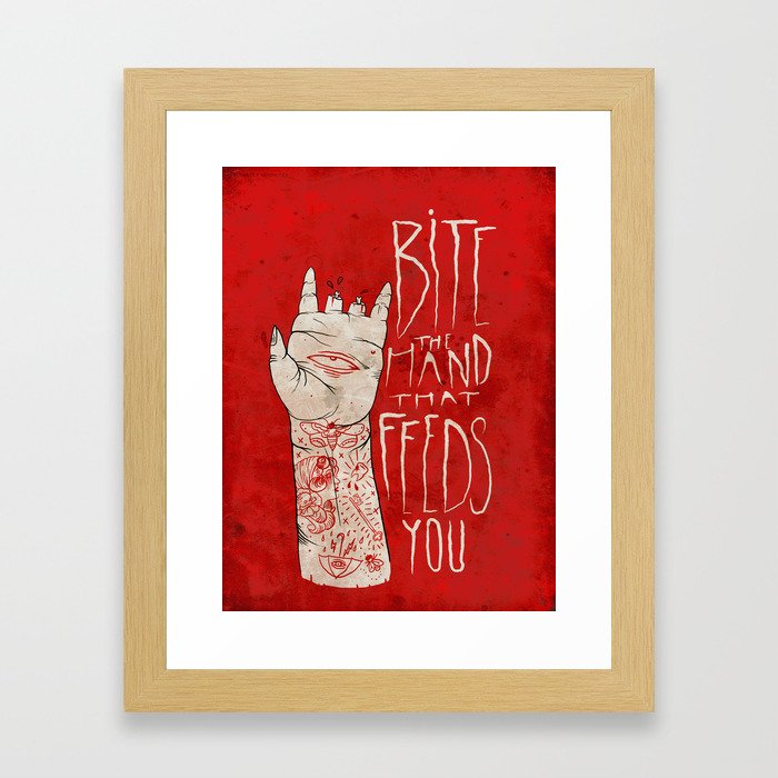 bite the hand. Framed Art Print