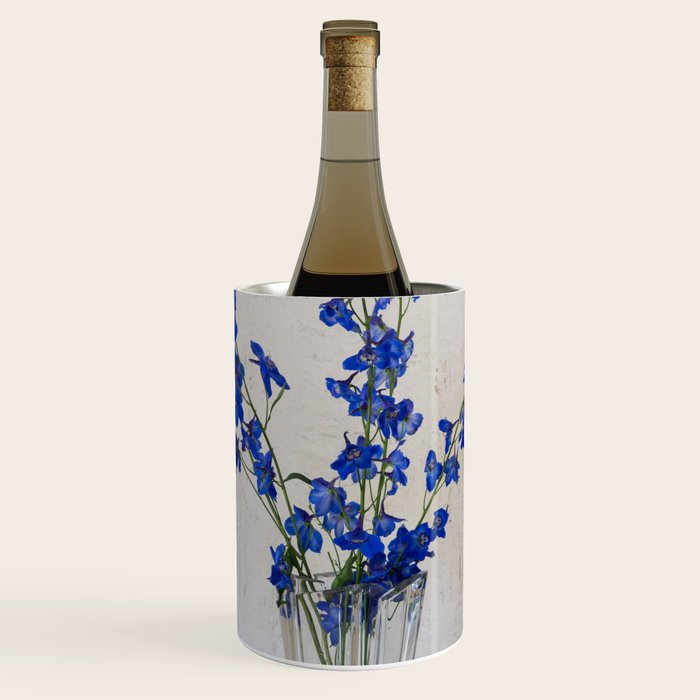 Beautiful blue delphinium volken flower arrangement in a crystal vase