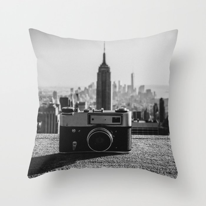 Vintage camera and the Manhattan skyline in New York City Throw Pillow