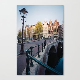Cute Canalhouses in Amsterdam city center with nice bridge Canvas Print